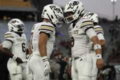 Texas State senior running back Lincoln Pare (7, left) and freshman quarterback Brad Jackson (8, right) hyping each other up while warming up against Arizona State, Saturday, Sept. 13, 2025 at Mountain America Stadium in Tempe, Arizona. The Sun Devils won win 34-15.
