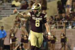 Texas State freshman quarterback Brad Jackson (8) gives a thumbs up for a play call against Eastern Michigan, Aug. 30, 2025, at UFCU Stadium. TXST won 52-27.