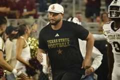 Texas State head coach G.J. Kinne running onto the field before kickoff against Arizona State, Saturday, Sept. 13, 2025, at Mountain America Stadium in Tempe, Arizona. The Sun Devils won 34-15.