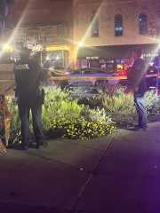 Officers put up crime scene tape to deter pedestrians from entering the crime scene after the Hopkins Street shooting, Saturday, Nov. 1, 2025, at The Square. The shooting left one dead and two injured.