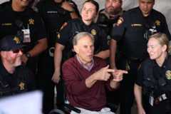 Gov. Greg Abbott meets with members of UPD while at a campaign event at Tailgate Central prior to Texas State's football game against Louisiana-Monroe, Saturday, Nov. 22, 2025, at UFCU Stadium.