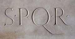 Stone slab with the inscription SPQR, initials of the Latin phrase SENATUS POPULUSQUE ROMANUS ("The Senate and People of Rome").