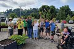 Sow 2 Grow students show off the fruits of their labors after harvesting an array of vegetables at the UT Gardens, Knoxville.