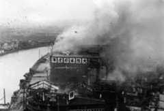 The battered and smoking Sihang Warehouse, the “Chinese Alamo,” during the battle.