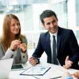 4 professionals in a meeting