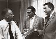 Teller, holding a document, meets with E. O. Lawrence and Herb York at the Livermore Lab.