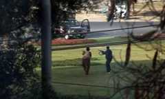 An image from a TV broadcast shows gunmen firing in the direction of a police vehicle.— Reuters