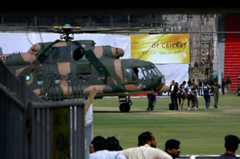 Sri Lankan officials and players prepare to board into a helicopter at Qadhafi stadium after the shooting.— AP