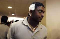 Ajantha Mendis, a member of the Sri Lankan cricket team, who was injured during the attack arrives at Colombo airport March 4, 2009.— Reuters