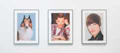 Line up of John Waters artworks including Lassie, a self portrait, and Justin Bieber