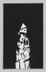 Against a black background, chalky organic shapes stack to form a totem-like structure.