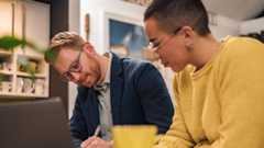 two employees working on documents