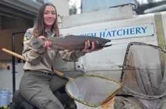 woman holding large fish