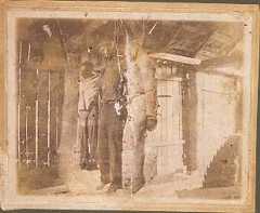 Real Photo Postcard of blodgeoned body of an African American male