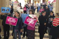 People both supporting and opposing abortion protest at the Statehouse March 5 in Providence, R.I. (Jennifer McDermott/AP)