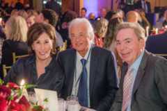 Summit Host Chairman Catherine B. Reynolds, Led Zeppelin founder Jimmy Page, and musical theatre composer and 2019 guest of honor Andrew Lloyd Webber at the introductory dinner of the International Achievement Summit at the Four Seasons Hotel.