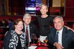 NIH Director Dr. Frances S. Collins and his wife, Diane, and Mark Crosswhite, the Chairman and CEO of Alabama Power Company, and his wife, Jane Emily at a reception at the FIFTY7 at the Four Seasons Hotel in New York City during the International Achievement Summit in New York City