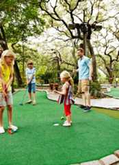 Family playing putt putt