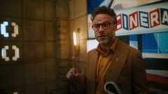 A flatscreen television showing a video of all Apple services available on Apple TV