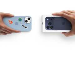 Hands exchanging trade-in iPhone 13 with Silicon cover, stickers on back exterior, for new iPhone 17 Pro in the box.