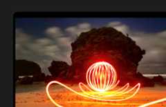 MacBook Pro screen of an extremely bright art installation on a beach, demonstrating contrast of the display due to Extreme Dynamic Range