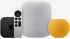 Apple TV 4k, Siri remote, one White HomePod and one yellow HomePod mini pictured side-by-side