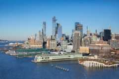 view of piers and buildings along the Hudson River waterfront in Manhattan