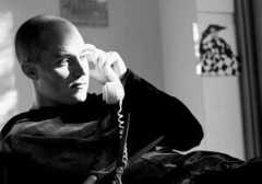 A black and white portrait of the British graphic designer John Morgan in 2002