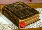 Old leather-bound Bible with ribbons marking pages