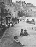 Makeshift homes in the rock face on the outskirts of Valetta