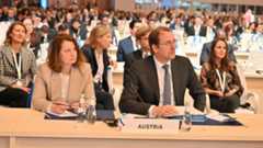 Secretary General Nikolaus Marschik at the 21st UNIDO General Conference in Riyadh: Promoting innovation and sustainable development with Austrian expertise, Picture: BMEIA Secretary-General Nikolaus Marschik (right), dressed in a dark suit, white shirt and dark tie, attends the 21st UNIDO General Conference in Riyadh. Next to him sits a colleague in a light-coloured blazer. Both are listening attentively to the proceedings. The setting is a large, modern conference hall with numerous delegates from various countries seated in rows at long tables. Austria is represented by a delegation committed to innovation and sustainable development.