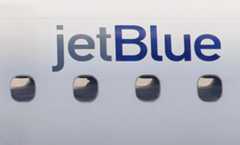 Airbus_Software_Fix_59358 FILE – A JetBlue logo is displayed on the side of a jet as it taxis at Boston’s Logan International Airport, Jan. 20, 2011. (AP Photo/Stephan Savoia, File)