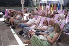 Customers on deckchairs in the Courtyard