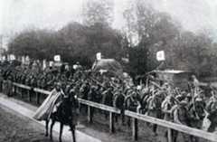 Advancing German infantry pass a Red Cross column: Battle of the Marne, fought from 6th to 9th September 1914, during the First World War