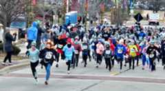ABN-L-THANKRUN-1128-01 Young people run up Houston Street in downtown Batavia Thursday morning at the start of the one-mile youth race that was part of the 29th annual The Fox and the Turkey Four Mile and One Mile Youth Race. (David Sharos/For The Beacon-News)