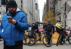 CTC-L-Michigan-Avenue-112225 Police officers are posted in the 100 block of North Michigan Avenue Saturday, Nov. 22, 2025, in Chicago. Nine teens were shot the previous night in two incidents a few blocks away, in the 100 block of North State Street and 100 block of South Dearborn Street. (John J. Kim/Chicago Tribune)