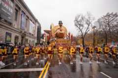 Macys_Thanksgiving_Parade_64394 FILE – Parade performers lead the Tom Turkey float down Central Park West at the start of the Macy’s Thanksgiving Day parade in New York on Nov. 28 2024. (AP Photo/Yuki Iwamura, File)
