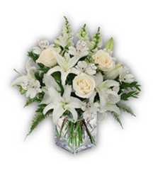 Arranjo de Condolências com Rosas, Lírios e Boca de Leão em vaso de vidro.