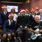 Ringwood Junior School children with producer Jamie Jordan and songwriter Simon Beale.