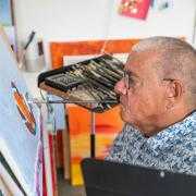 Rob Trent working on his Christmas Robin painting