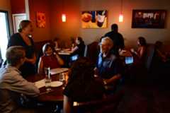 Bettola Restaurant, Bettola Bistro's co-owner and manager Rachel Firestone, top left, takes dinner orders at a table on July 19, 2019. (Photo by Hyoung Chang/The Denver Post)