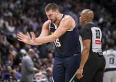 Nikola Jokic (15) of the Denver Nuggets pleads his case to referee Tre Maddox (23) after not receiving a foul call up taking lower back contact from Luka Doncic (77) of the Dallas Mavericks during the third quarter at Ball Arena in Denver on Sunday, Nov. 10, 2024. (Photo by AAron Ontiveroz/The Denver Post)