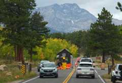 Visitors drive past empty guard shack on the road to Bear Lake in Rocky Mountain National Park because of the shutdown of the federal government Wednesday, Oct. 1,2025, in Estes Park, Colo. (AP Photo/David Zalubowski)