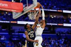 Denver Nuggets guard Peyton Watson (8) goes to the basket against New Orleans Pelicans forward Trey Murphy III (25) in the second half of an NBA basketball game, Wednesday, Nov. 19, 2025, in New Orleans. (AP Photo/Gerald Herbert)