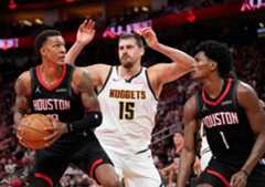 Houston Rockets forward Jabari Smith Jr. (10) looks to shoot a basket against Denver Nuggets center Nikola Jokic (15) and Rockets guard Amen Thompson (1) during the second half of an NBA Cup basketball game, Friday, Nov. 21, 2025, in Houston. (AP Photo/Karen Warren)