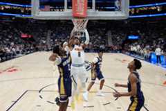Denver Nuggets guard Peyton Watson (8) goes to the basket against New Orleans Pelicans forward Herbert Jones (2) in the first half of an NBA basketball game, Wednesday, Nov. 19, 2025, in New Orleans. (AP Photo/Gerald Herbert)