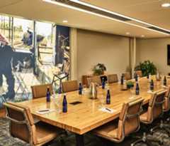 large meeting room with chairs and a long table