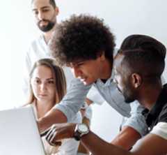 CIOB Staff discussing topic over laptop 350.jpg