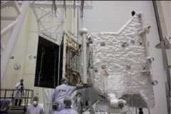 Figure 148: ESA's MPO (Mercury Planetary Orbiter) first saw the 7.5 m long three-panel solar wing being attached, and then unfurled. This was the first time the array had been deployed while attached to the orbiter. The panels were held from above to simulate the weightlessness of space (image credit: ESA)