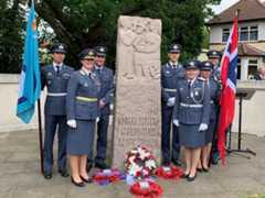 Norwegian group beside Norwegian Stone at North Weald Airfield Memorial in 2019